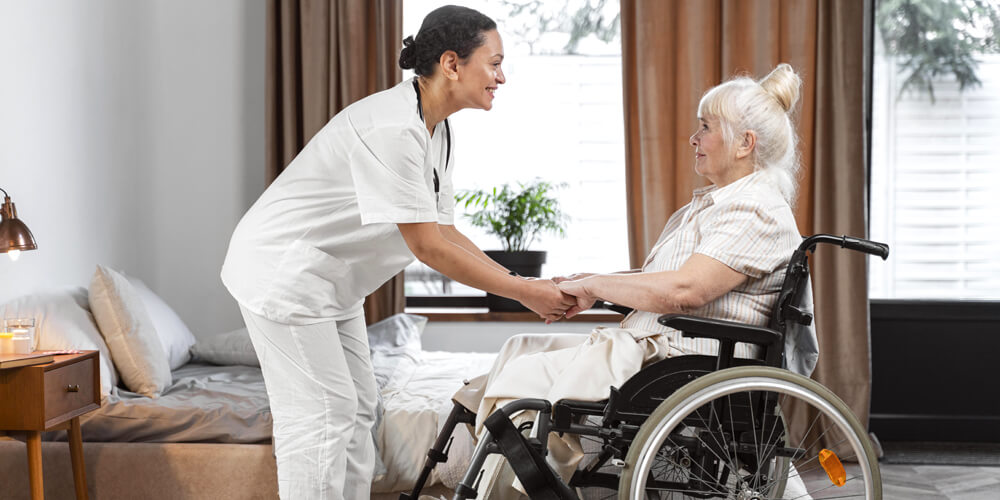 Professional auxiliary nurse giving assistance to an elderly patient in a wheelchair