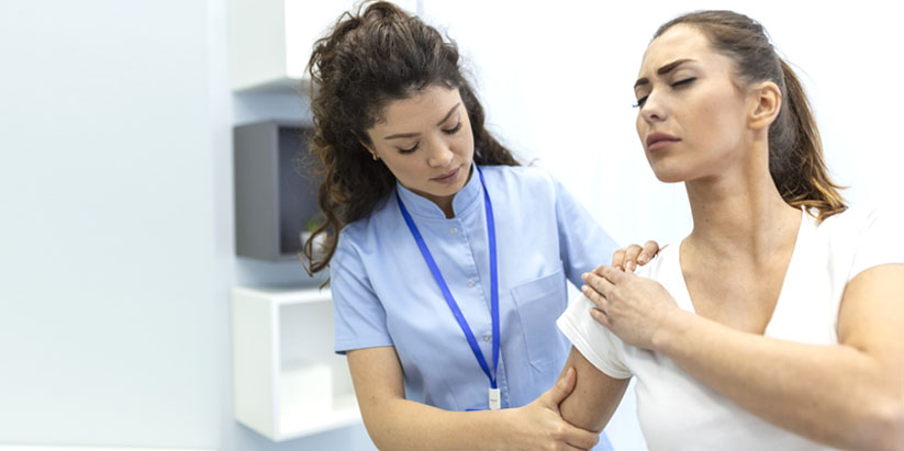 A young lady's sprain is being treated by an emergency nurse practitioner.