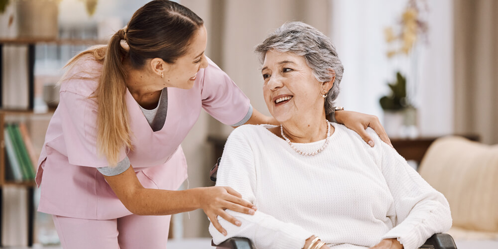 Nursing staff assisting a senior citizen with daily activities