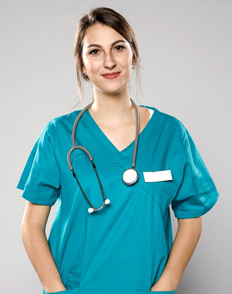 A nursing staff wearing a statoscope and smiling for a photograph.